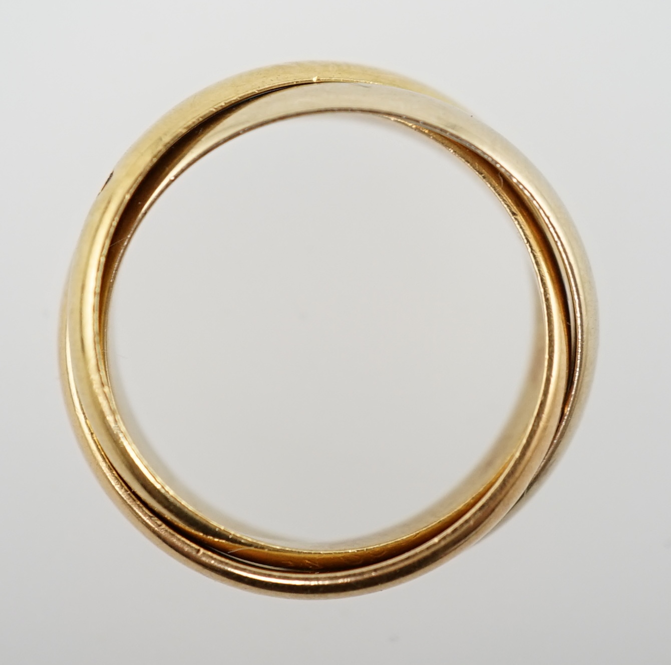 A modern French Cartier three colour 18k gold 'Russian' wedding ring
